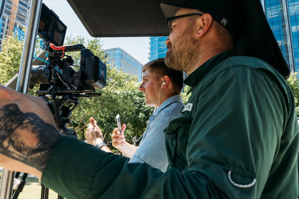 The Pineapple Avenue crew directing a shoot from the camera cart in downtown Dallas